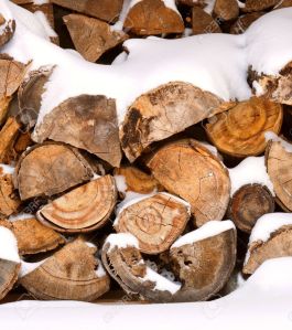 6786303-A-stack-of-firewood-covered-in-snow--Stock-Photo